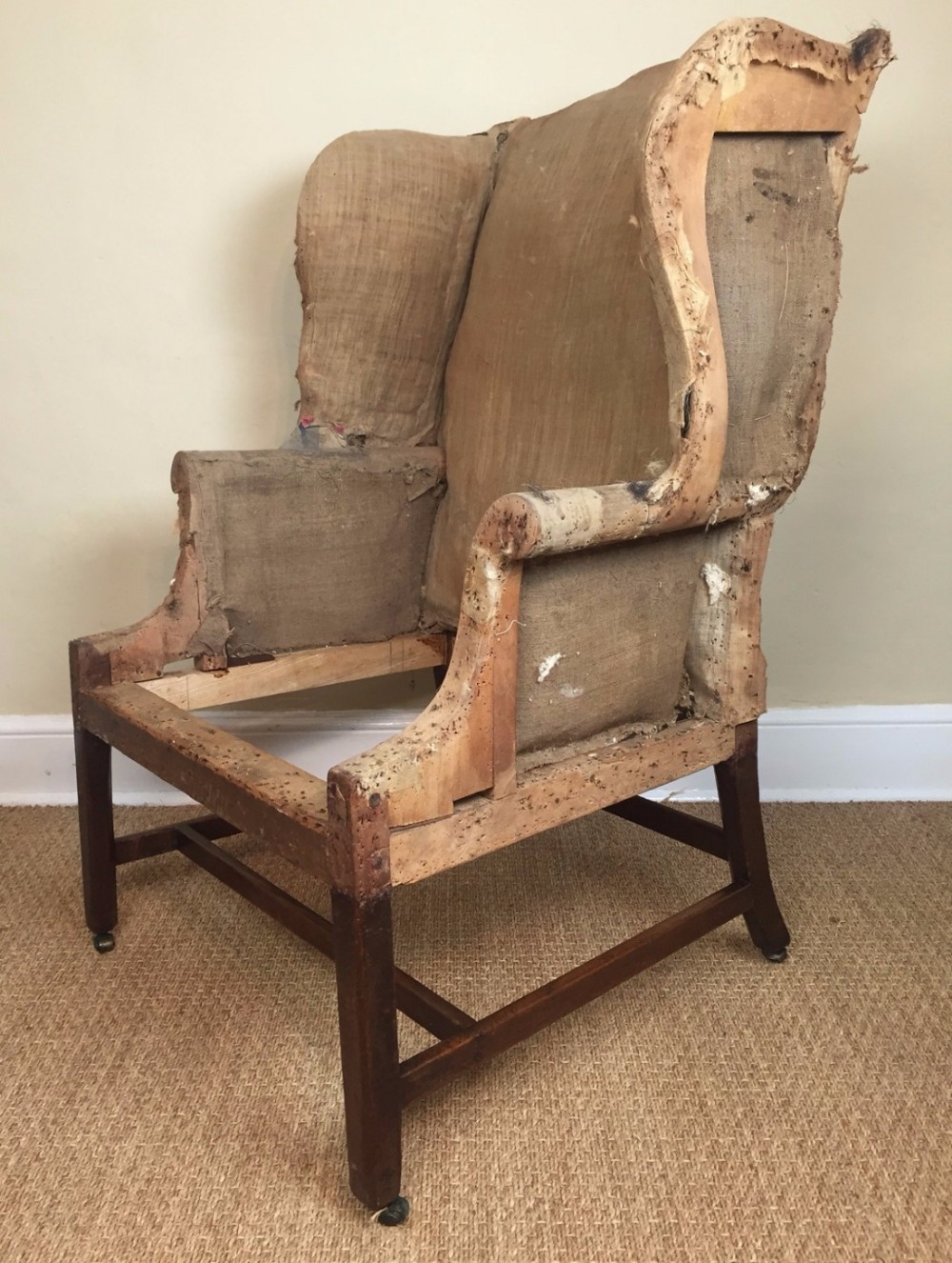 A large early George 111 mahogany wing chair circa 1770