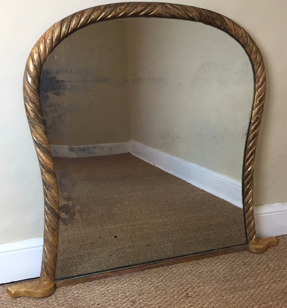 A William IV cartouche shape rope twist overmantel mirror circa 1835