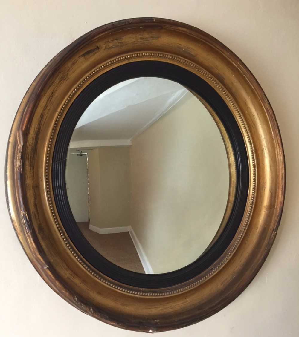 A good size George IV gilt wood convex mirror circa 1830 