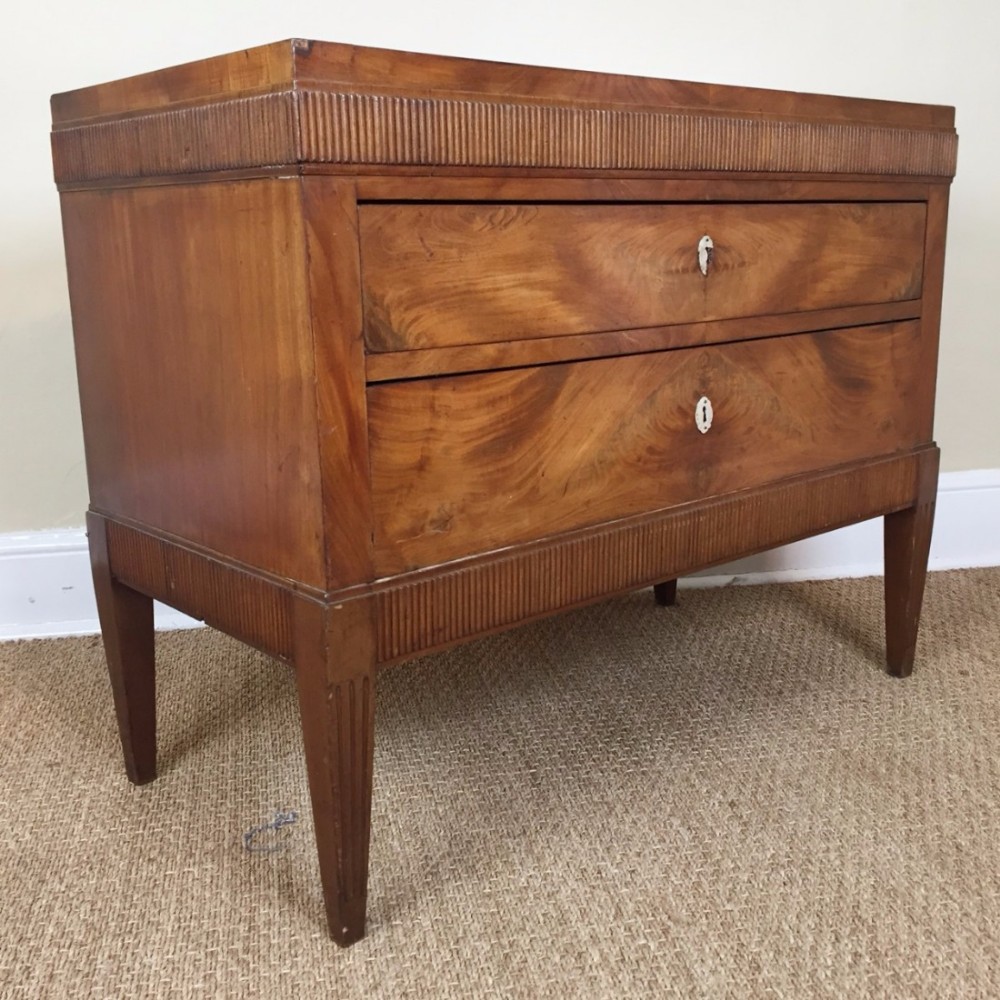 A North Italian faded mahogany two drawer commode circa 1820