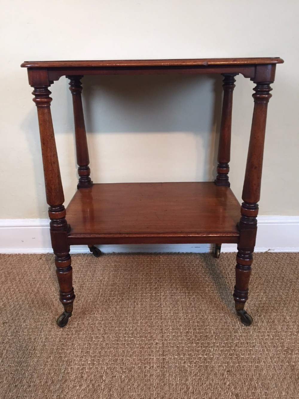 A mid Victorian mahogany two tier table by Collinson and Lock circa 1870