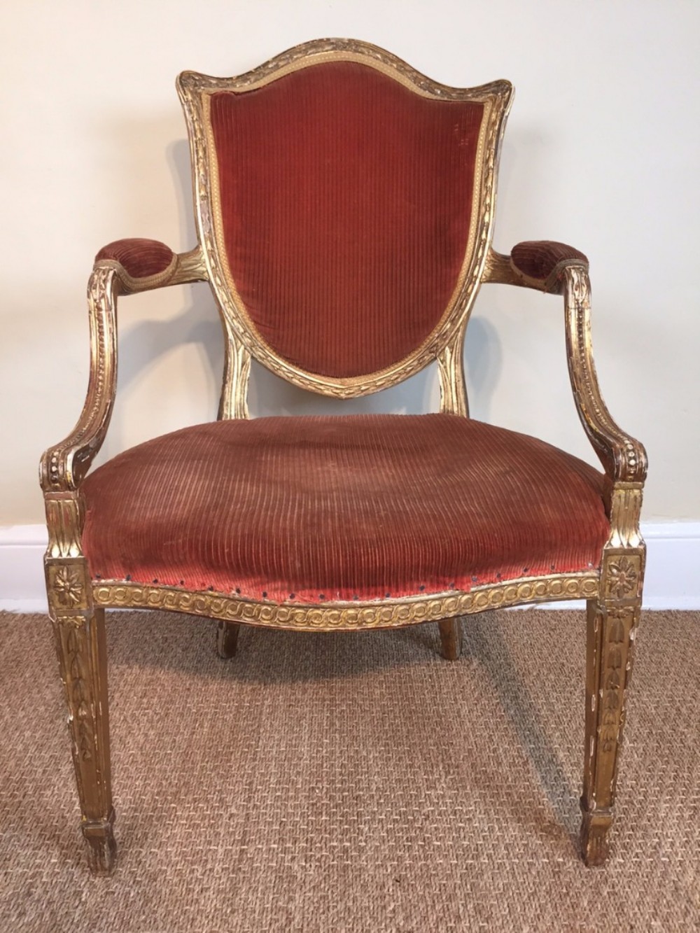 A George 111 giltwood armchair c 1775 in the French Hepplewhite taste