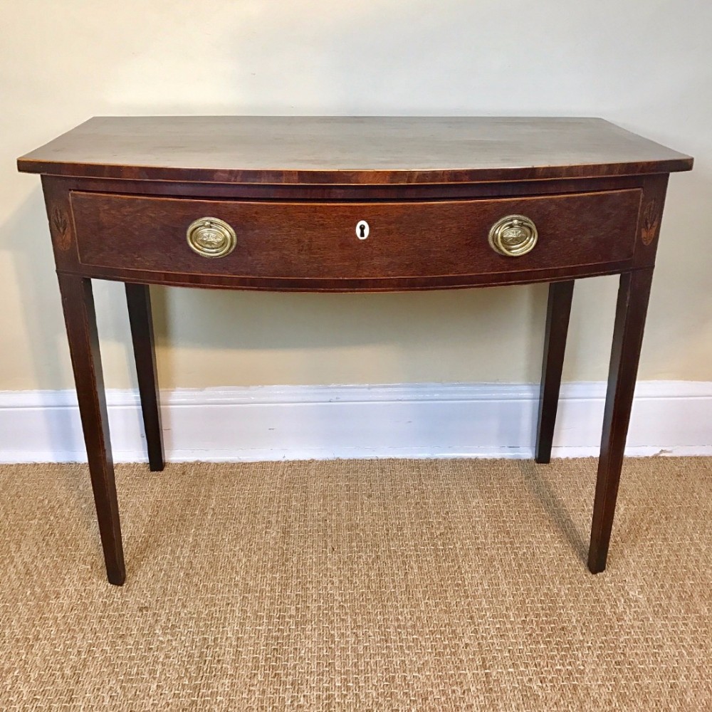 A George 111 mahogany and inlaid Sheraton period bowfront sidetable circa 1790.