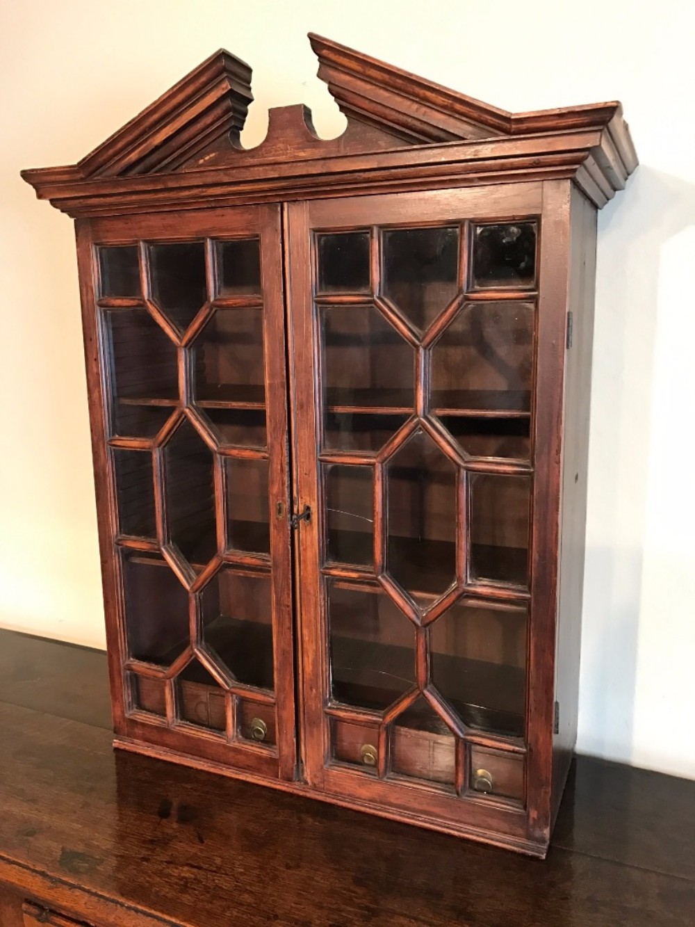 A George 111 architectural painted pine wall cabinet circa 1800