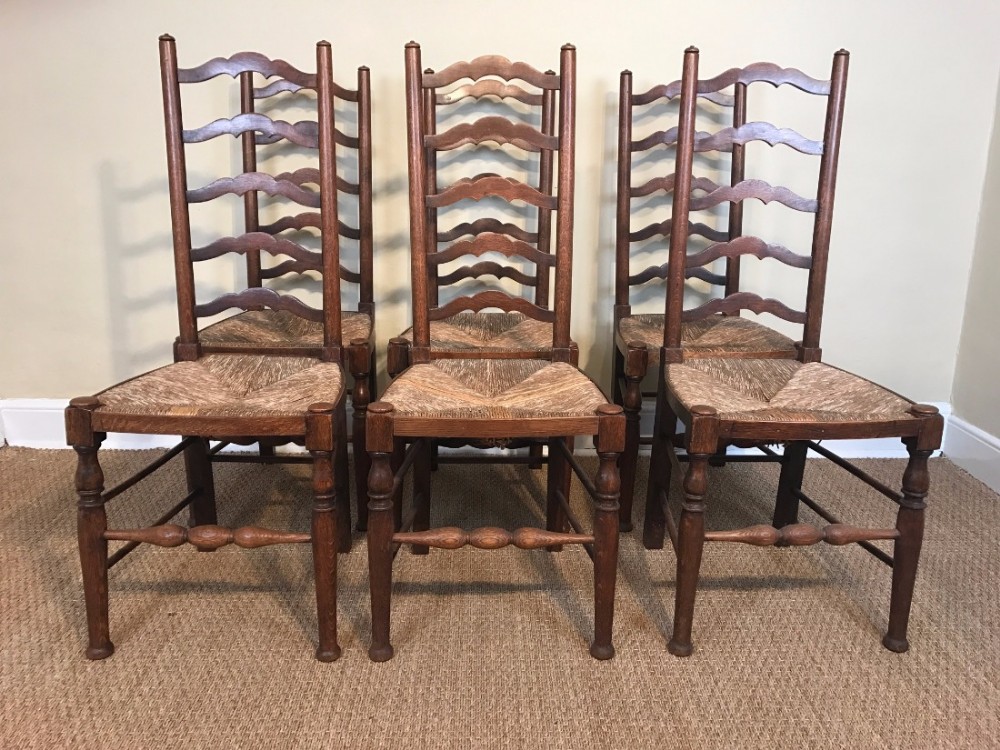 A set of six Arts and Crafts oak dining chairs circa 1910 
