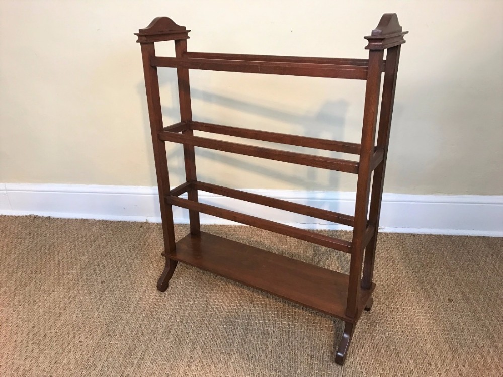 An Edwardian walnut towel rail circa 1910