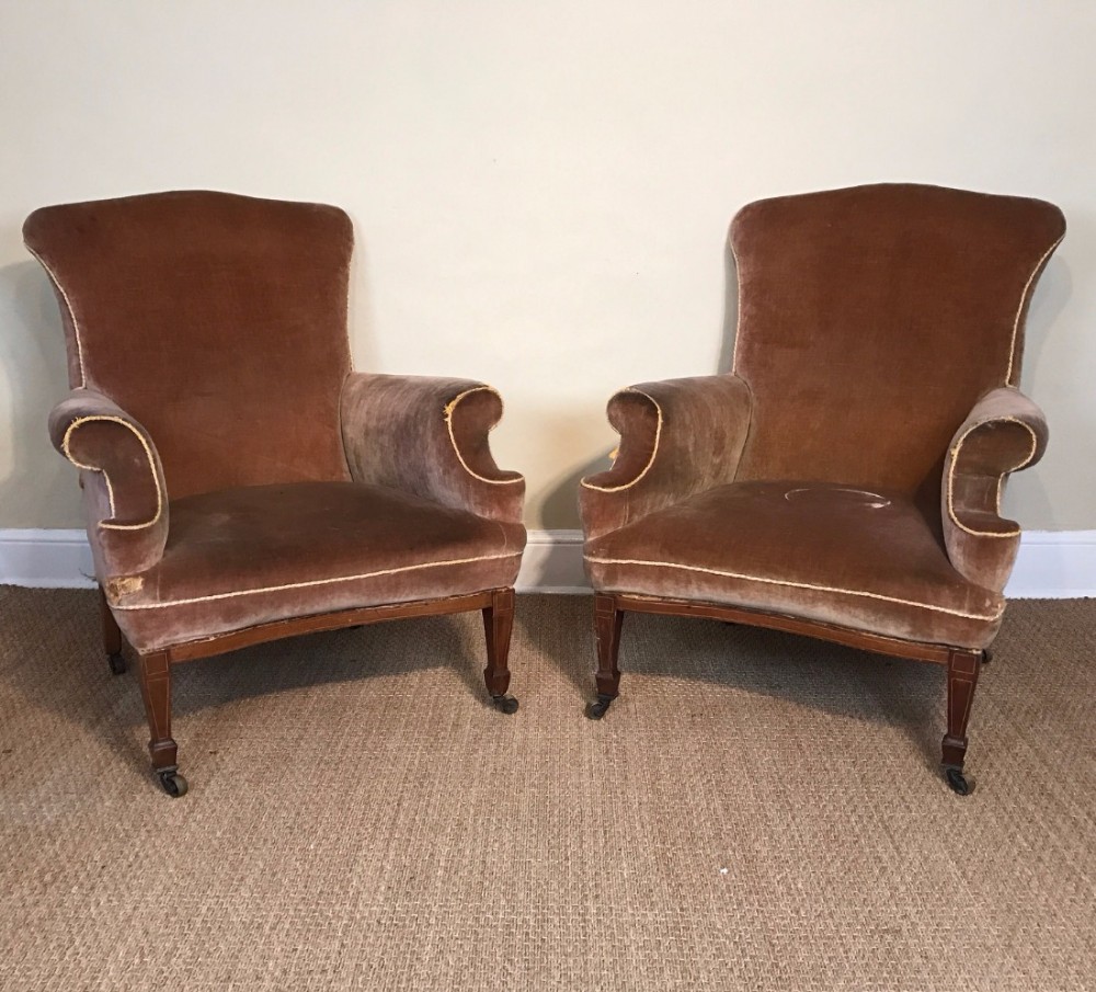 A large pair of Edwardian mahogany library chairs circa 1905