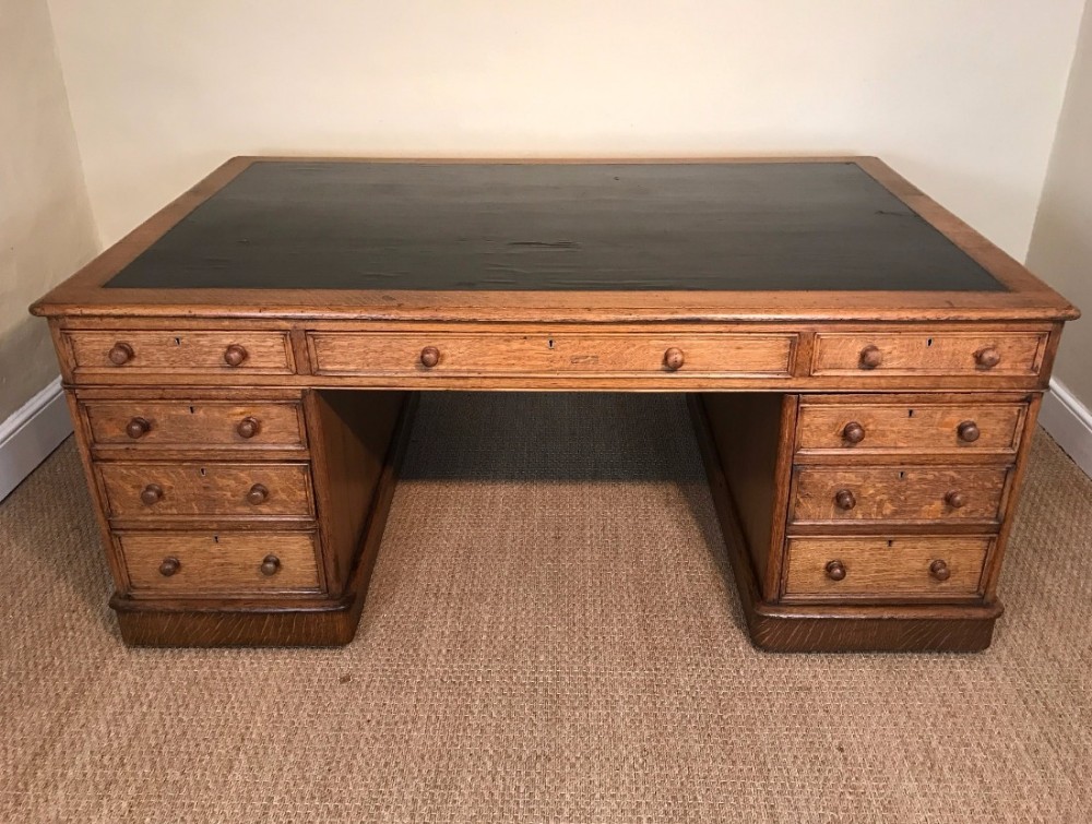 A large Victorian pale oak partners desk circa 1880 