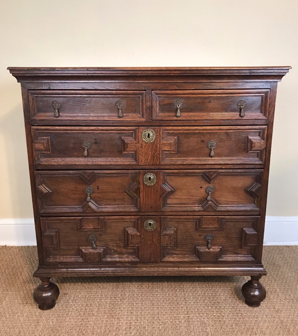 A Jacobean oak block fronted chest of drawers circa 1680