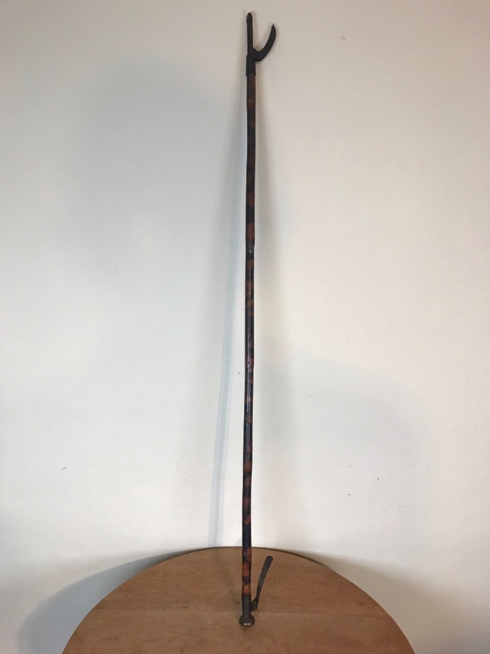 An unusual mid 19th c simulated bamboo iron and brass book carrier.