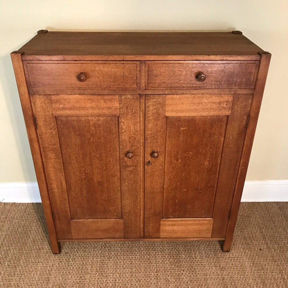 A Heals oak linen cupboard circa 1925.
