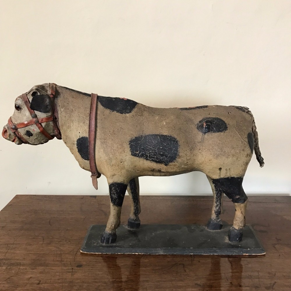 An unusual late 19th c Welsh painted papier mache model of a bull circa 1880.