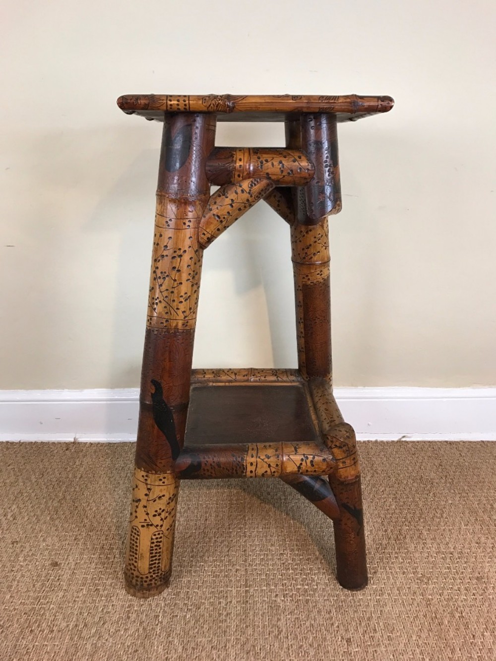 An unusual late 19th-century French bamboo lacquer two tier stand