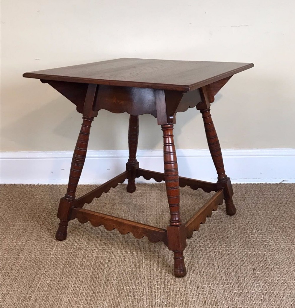 An Aesthetic movement oak two tier table circa 1880