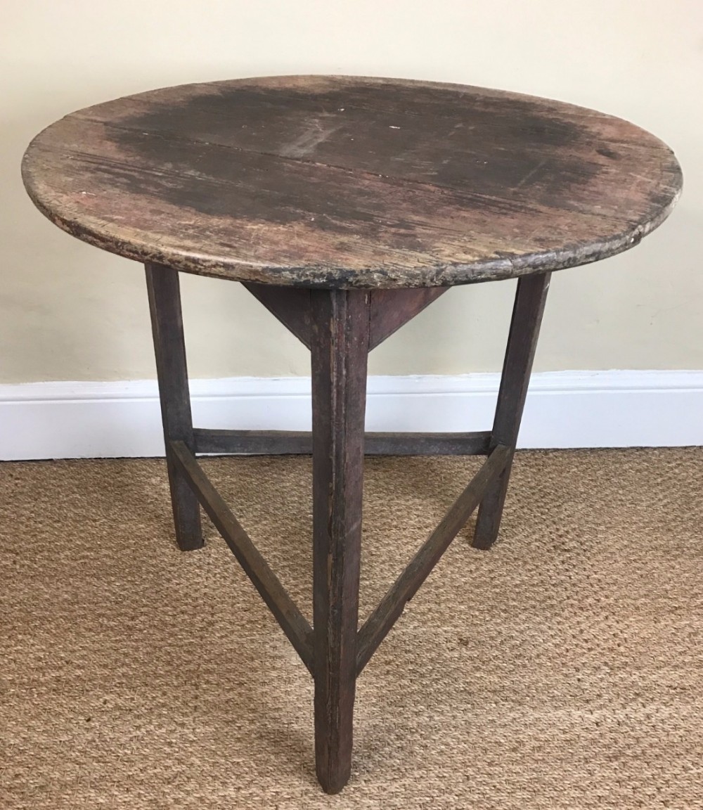 A late Georgian West Country painted pine cricket table circa 1830.