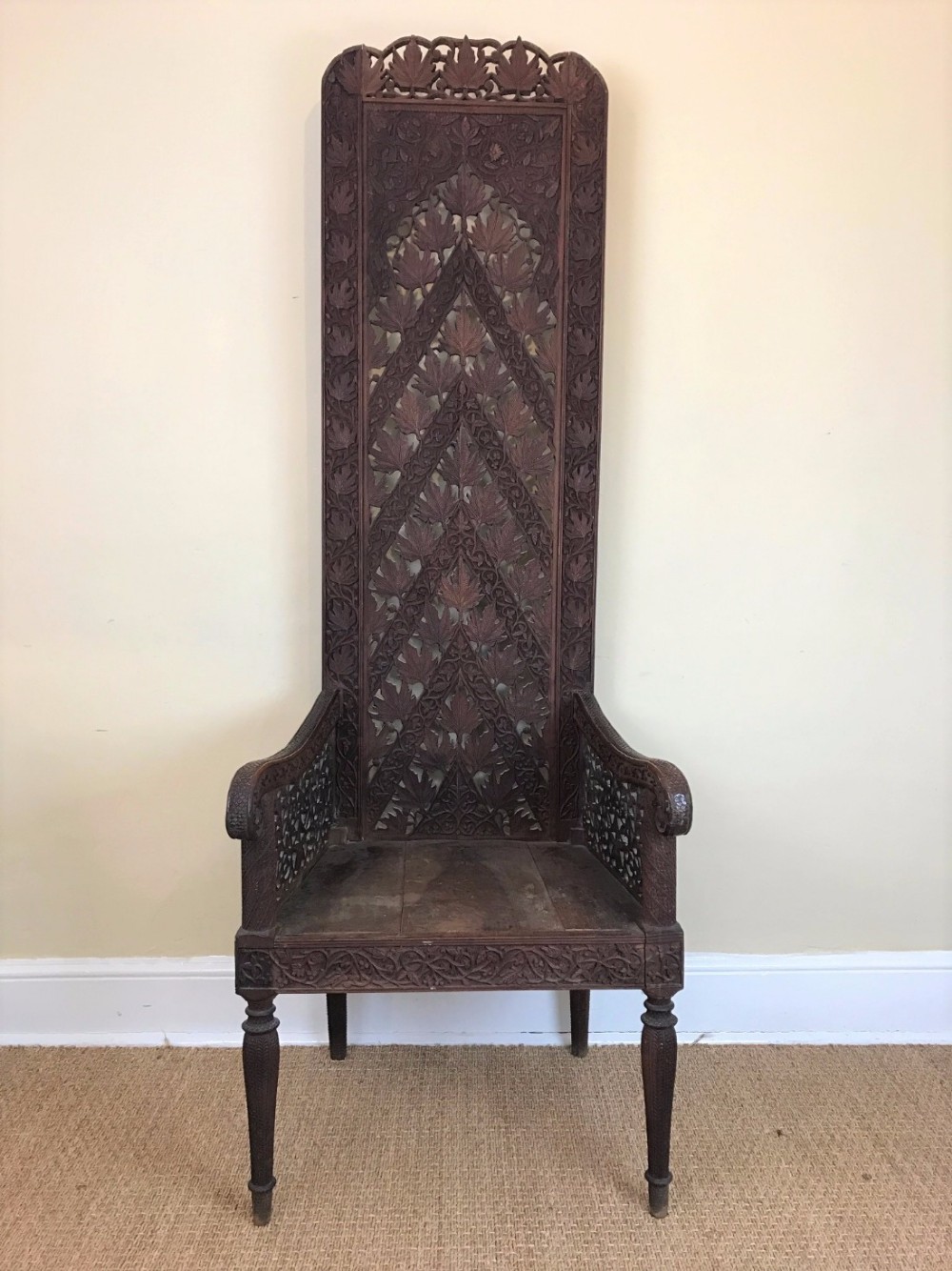 An extraordinary Indian carved teak throne chair Bombay Presidency circa 1880.