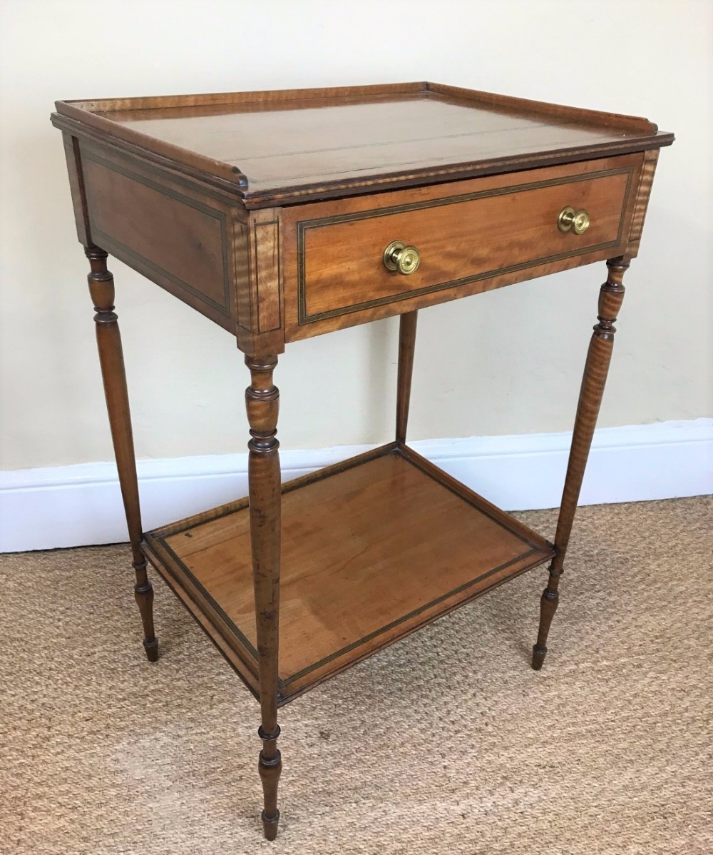 A mid 19th century English satinwood  two tier lamp table circa 1840