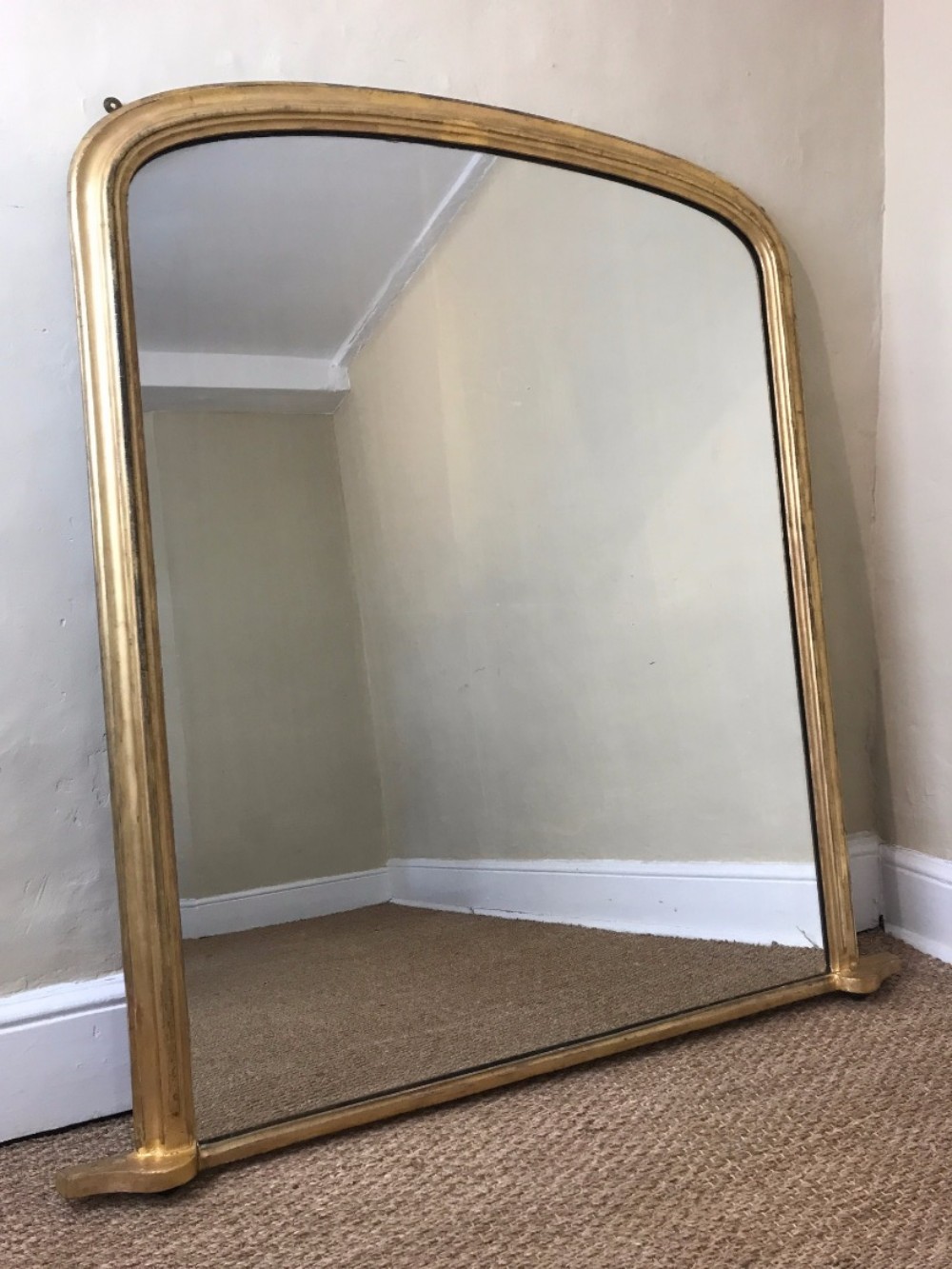 A Victorian arched gilt over mantel mirror circa 1860 