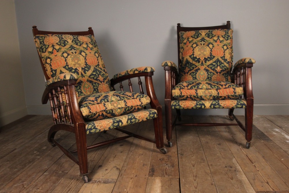 A pair of late 19th century Morris and Co reclining armchairs circa 1890.