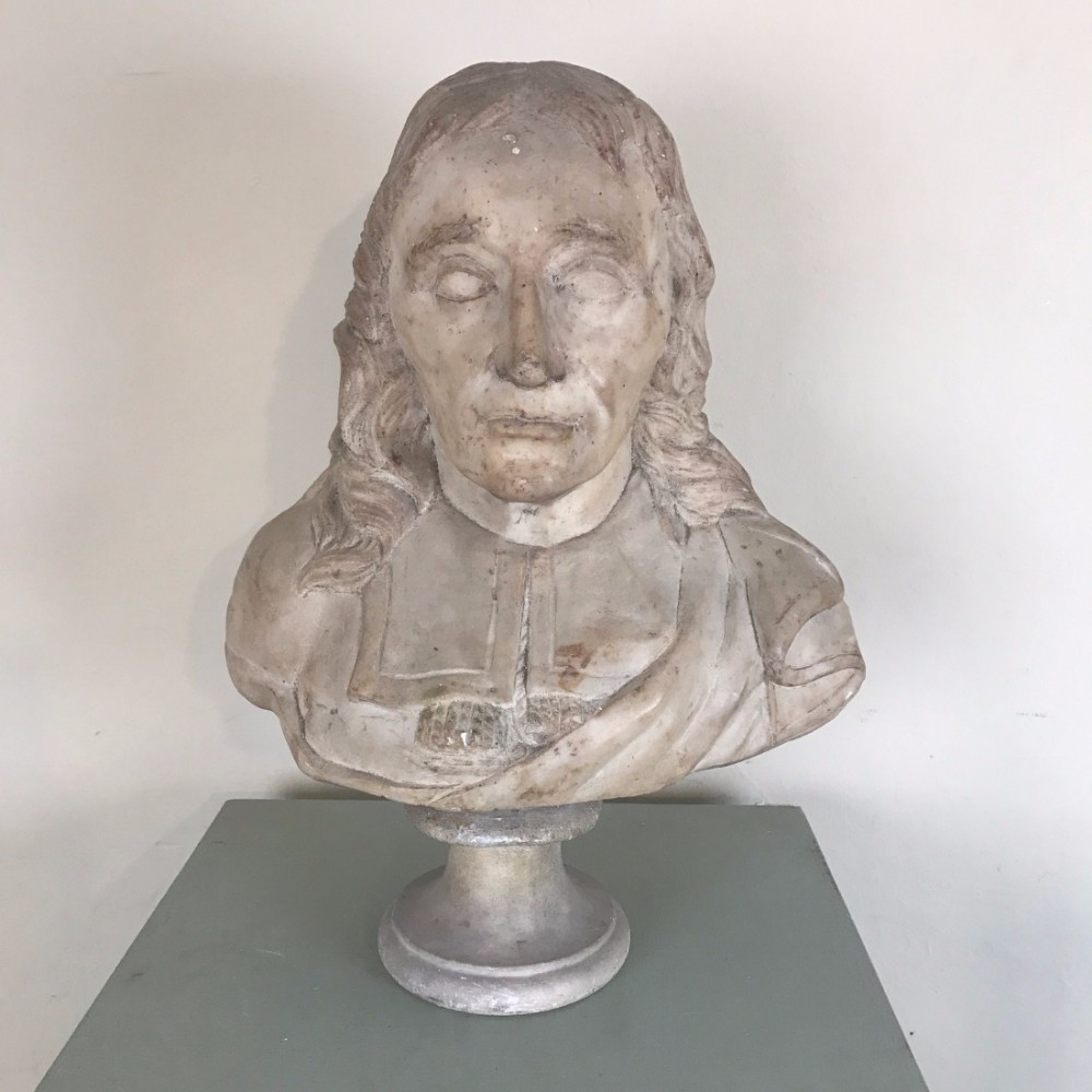 A late 17th century provincial English marble bust of a man possibly John Milton