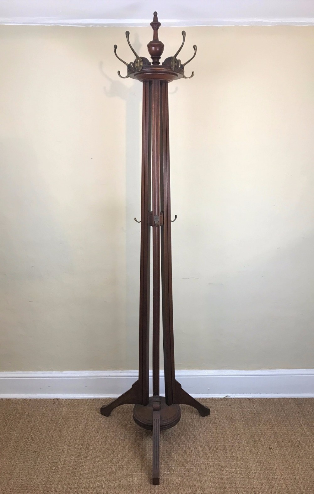 A late Victorian walnut revolving hat and coat stand circa 1890
