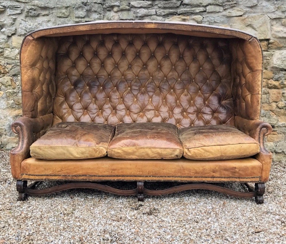 A spectacular Edwardian leather hooded porters sofa circa 1910