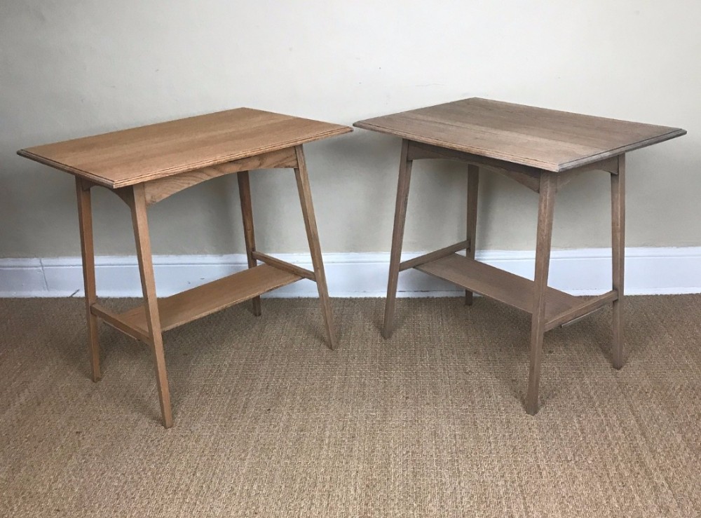 A pair of Aesthetic movement oak two tier side tables circa 1890 .