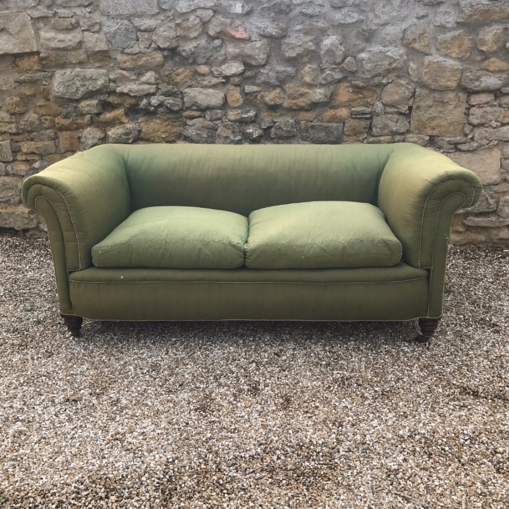 A late Victorian mahogany two seater chesterfield sofa c 1890