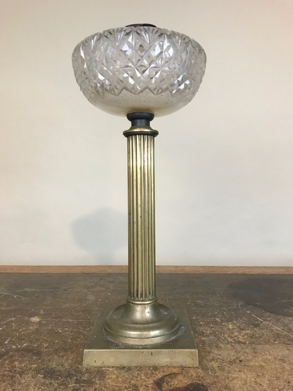 A Victorian brass oil lamp circa 1860 with cut glass reservoir bowl.
