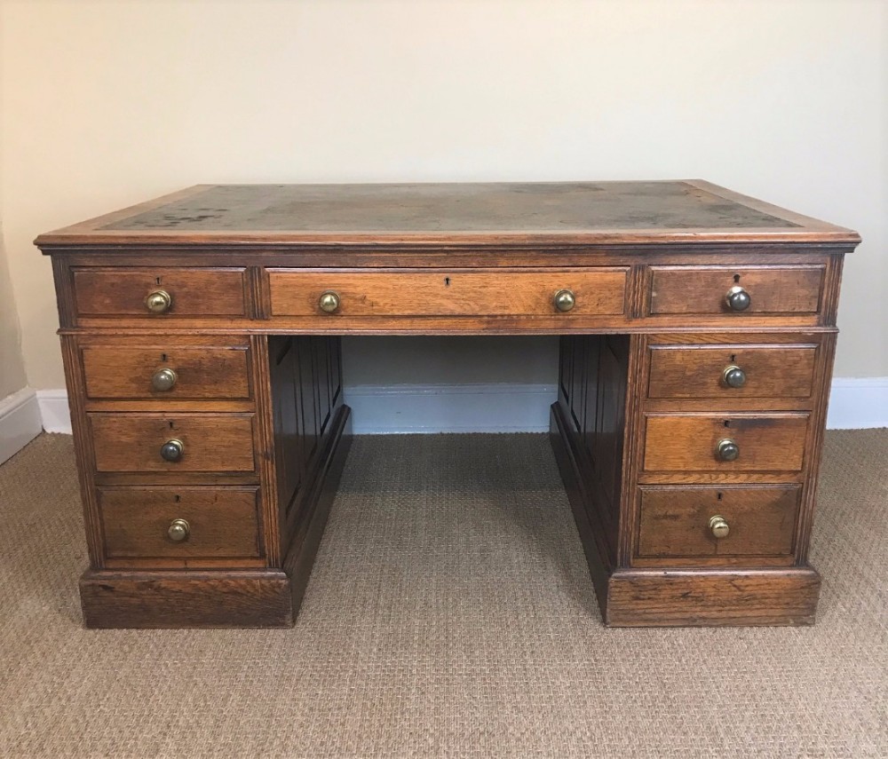 A late Victorian oak partners desk circa 1900
