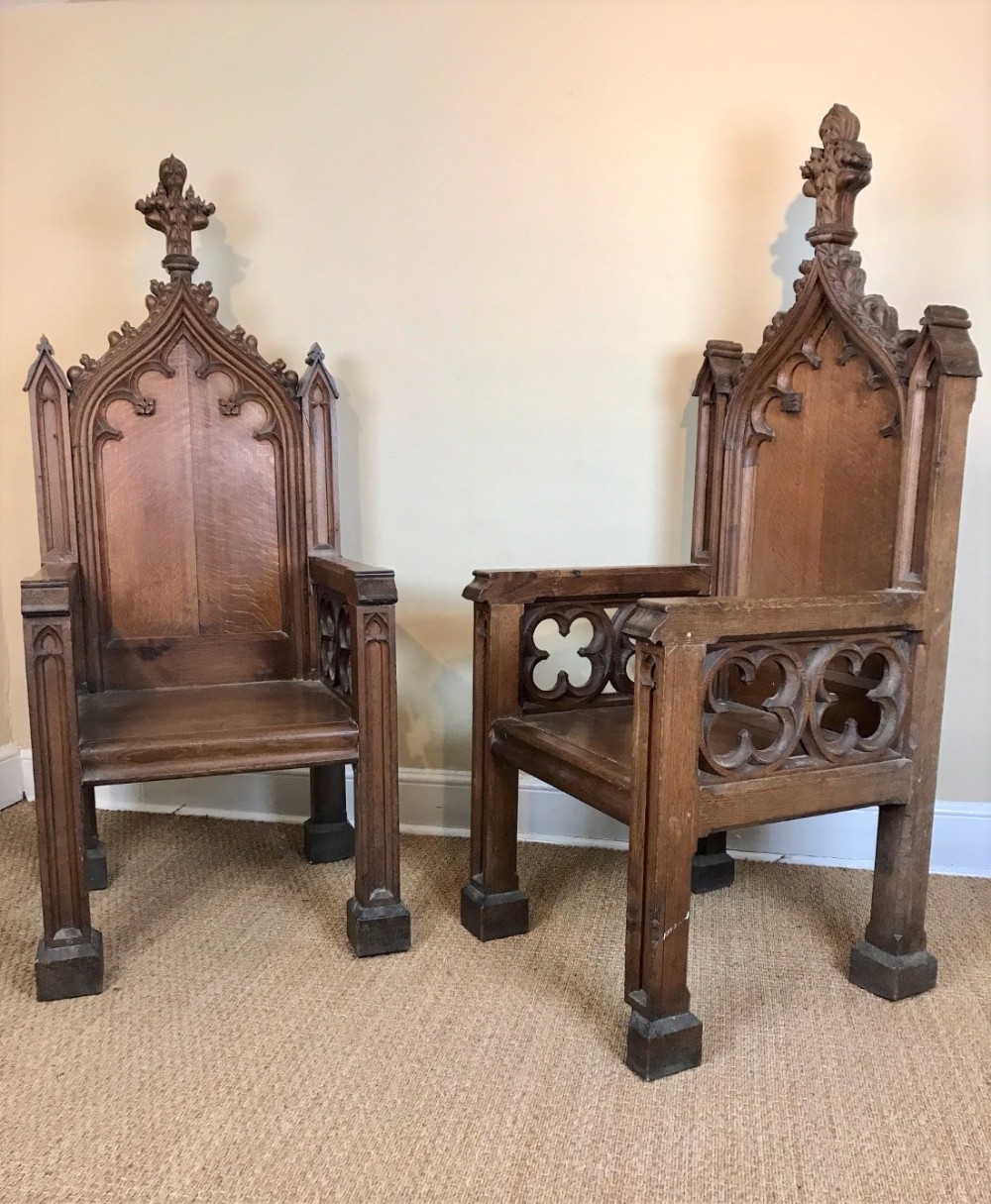 A monumental pair of English Gothic oak throne chairs circa 1860