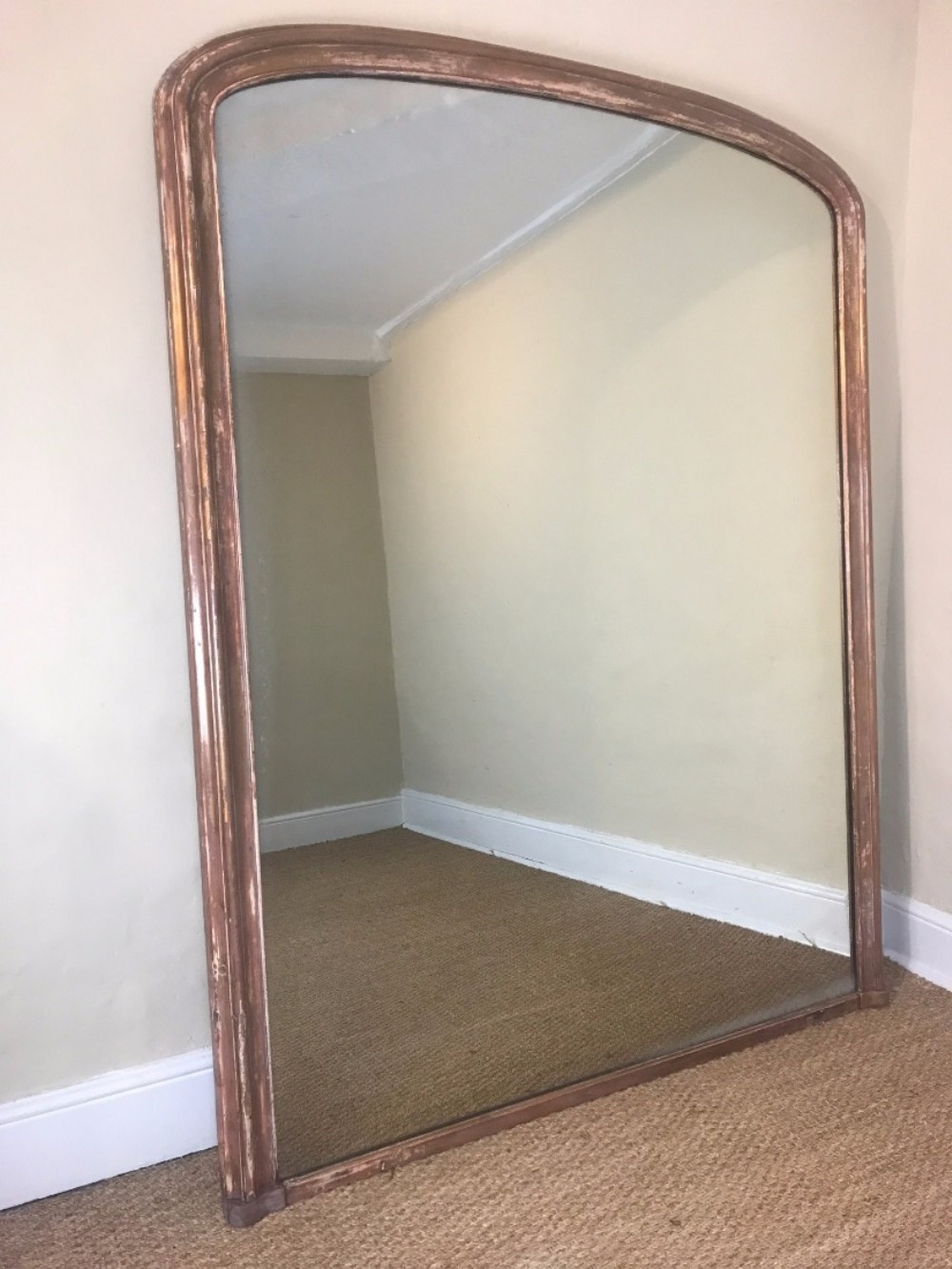 A large Victorian arched gilt over mantle mirror circa 1870
