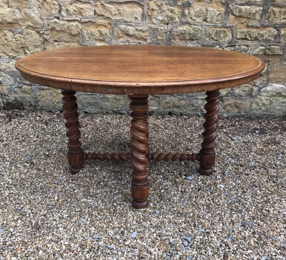 A Victorian oak oval barley twist table by C Hindley London c 1870