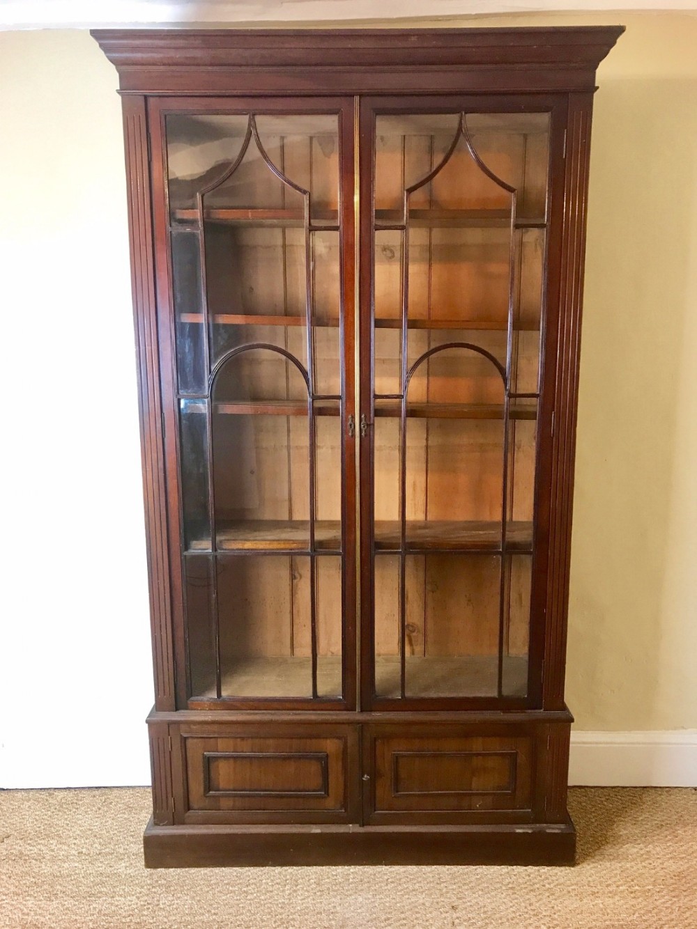 A George IV mahogany glazed standing bookcase circa 1830