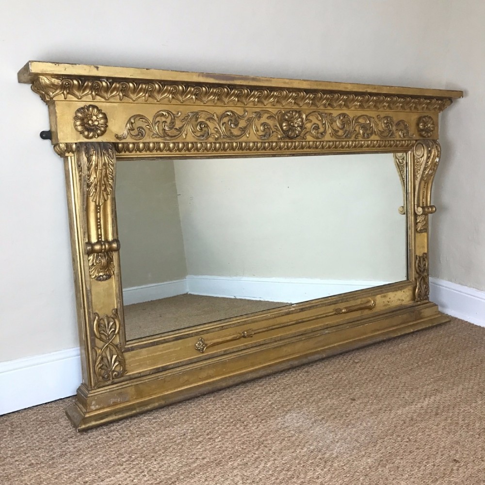 A large and imposing Regency gilt over mantel mirror c 1825