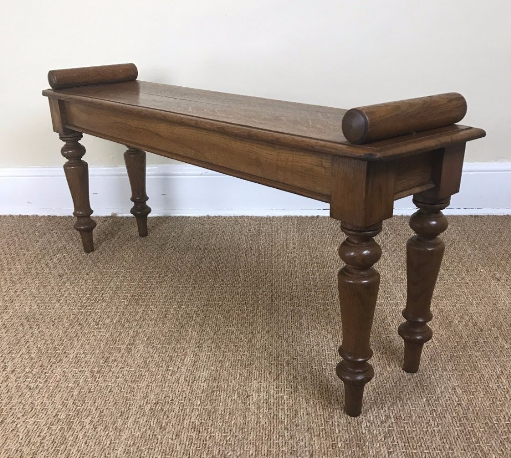 A Victorian oak hall bench circa 1870 in warm mid coloured oak