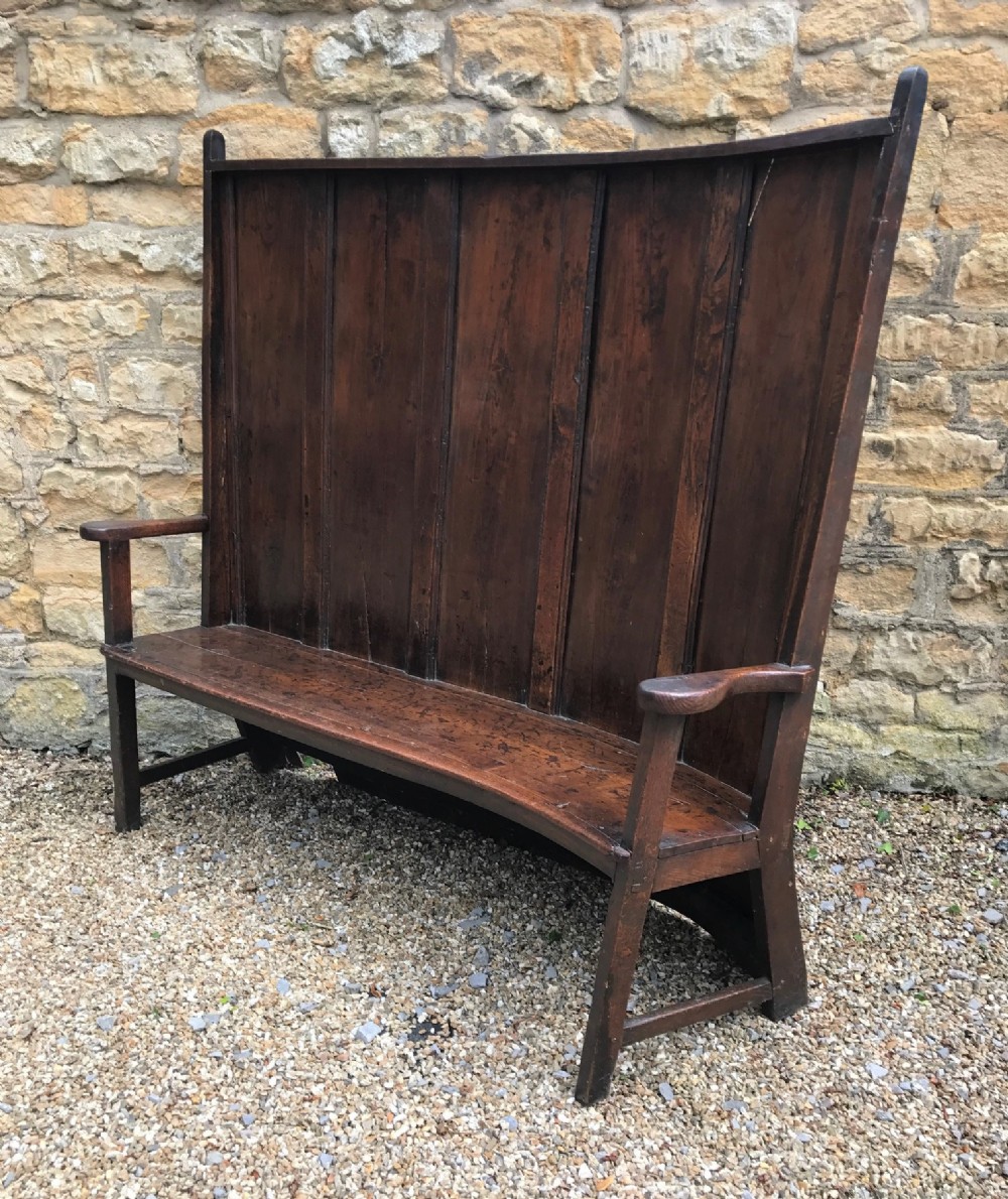 A George 111 fruitwood and oak corner settle West Country circa 1800