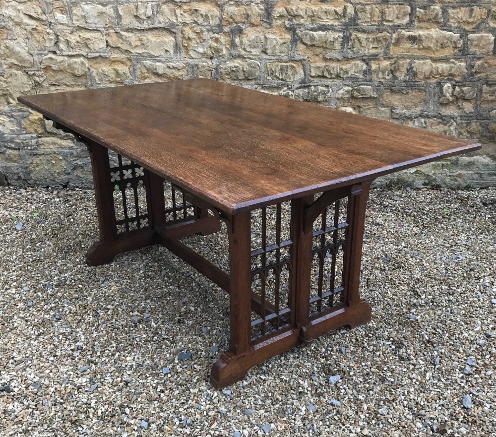 An early Victorian Gothic Oak library table c 1845 the design attributed to A W N  Pugin 