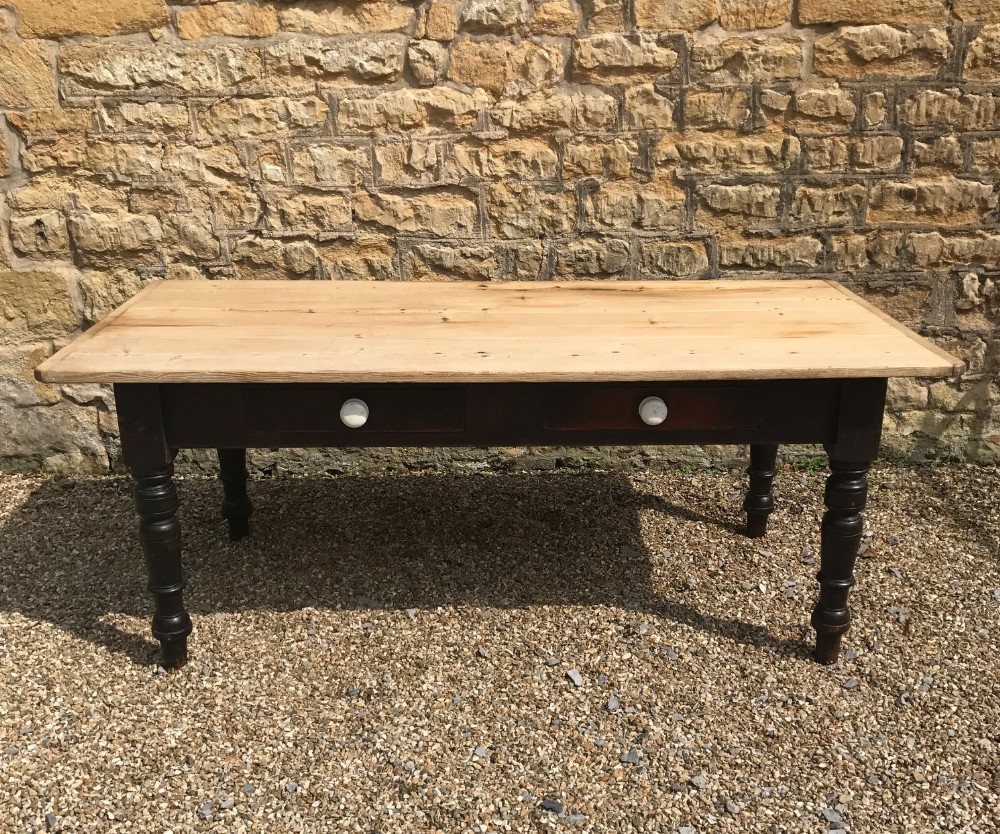 A large Cornish scrubbed pine kitchen table circa 1890