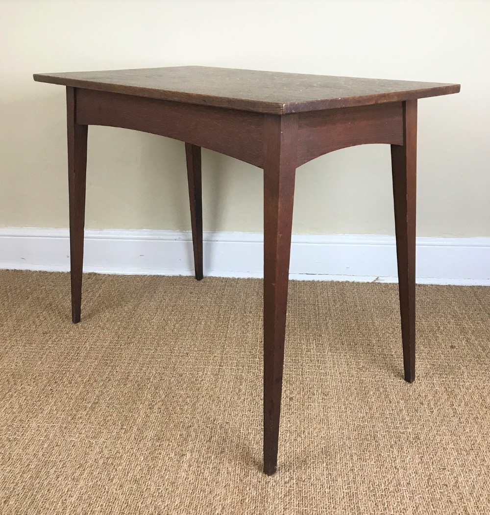 An Arts and Crafts oak rectangular table c 1910