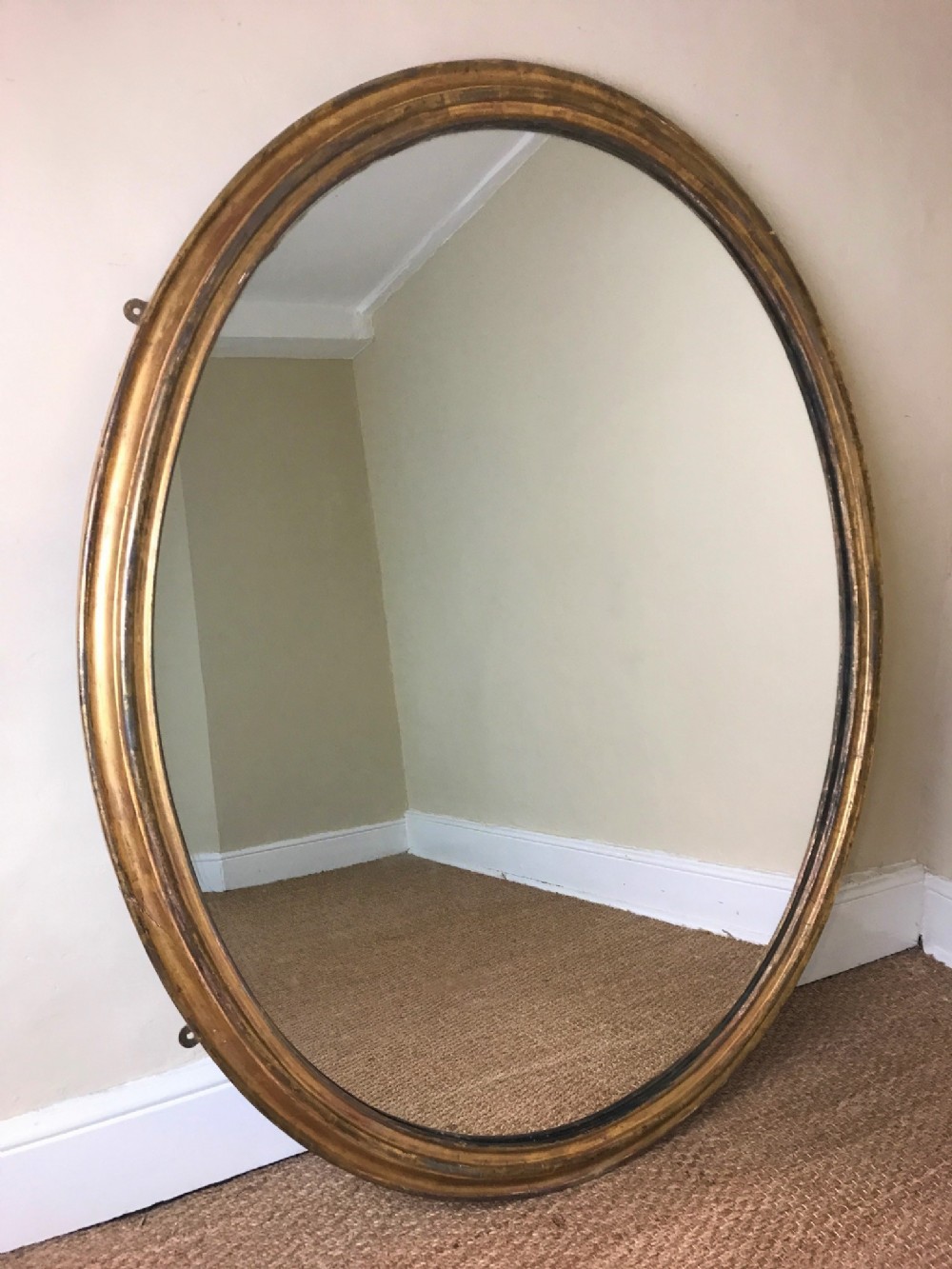 A large mid 19th century English oval water gilt mirror circa 1840