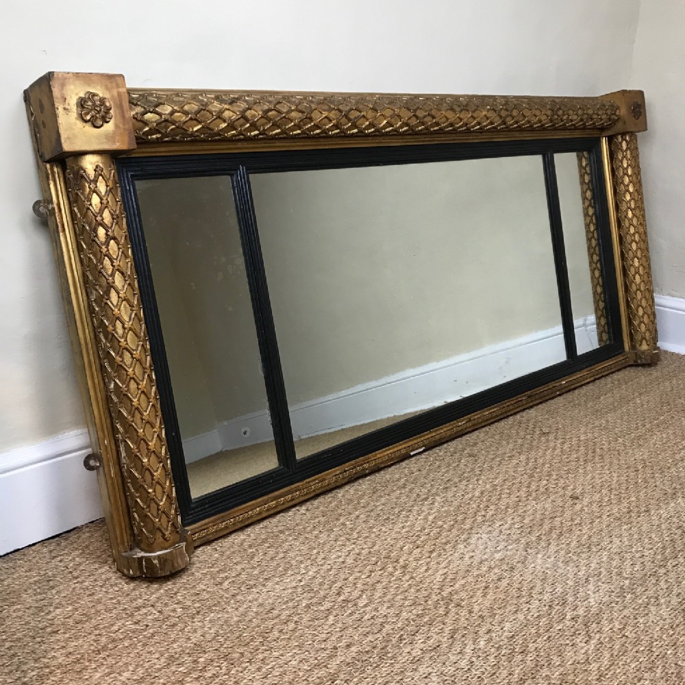 A George IV gilt over mantle triple plate mirror c 1830
