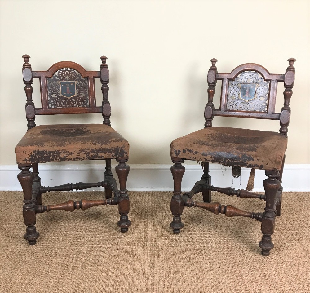 A pair of Irish Victorian oak and leather hall chairs c 1865