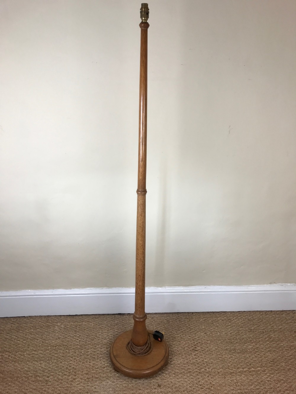 A Heals oak standard lamp circa 1930