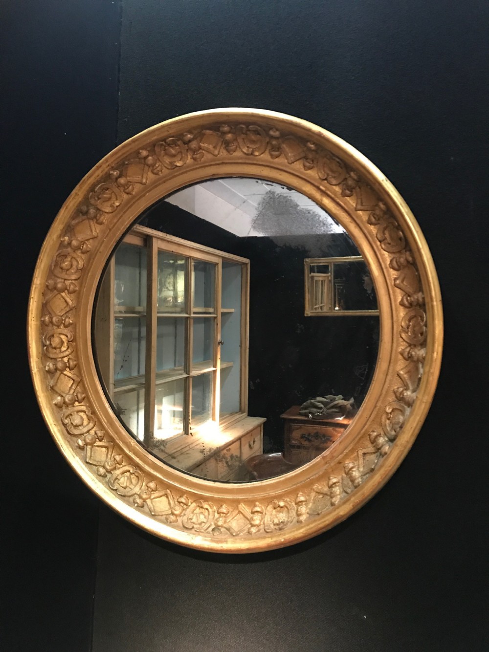 A large William IV Gothic water gilt circular mirror circa 1835 