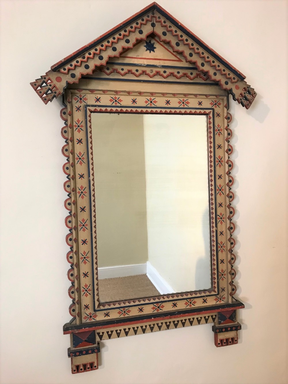An Aesthetic Movement painted arched mirror. English circa 1880.