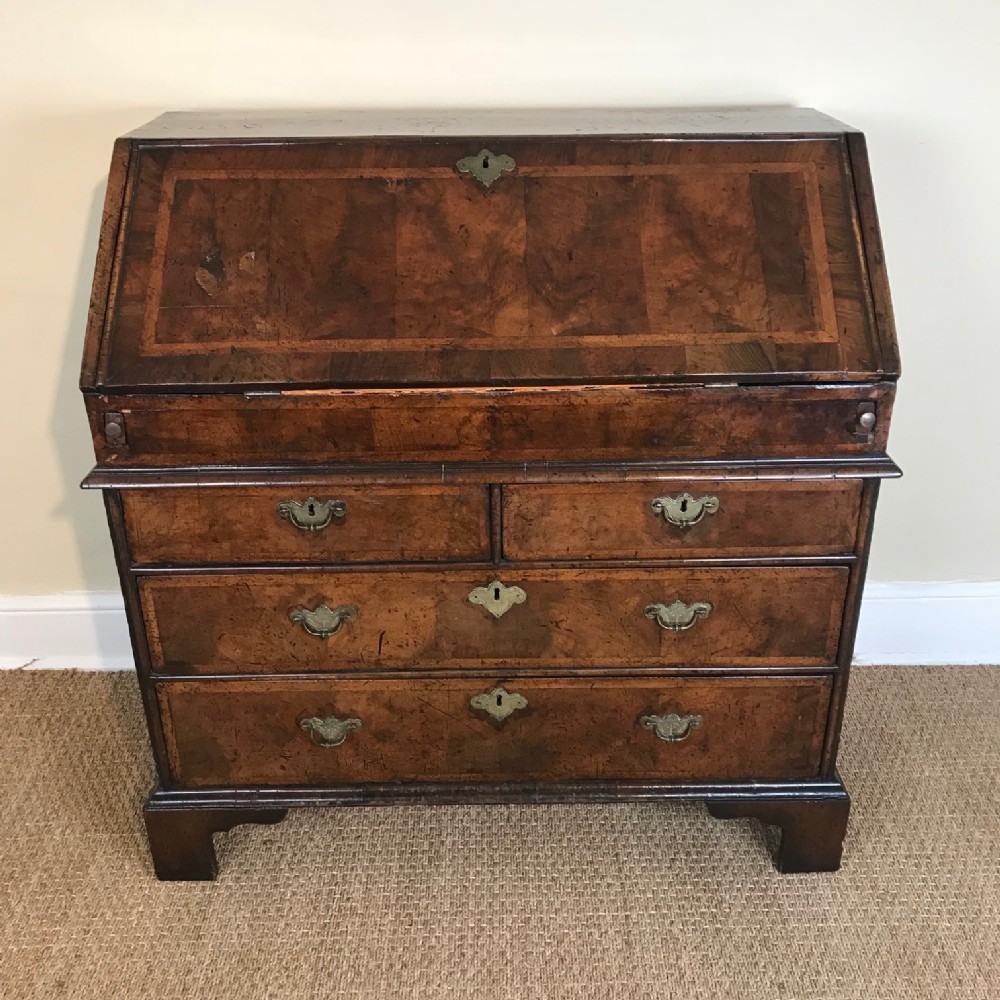 A George 1 walnut bureau circa 1725