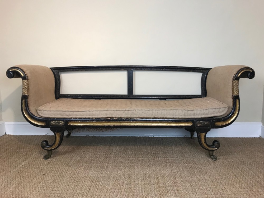 A Regency ebonised and parcel gilt sofa circa 1820