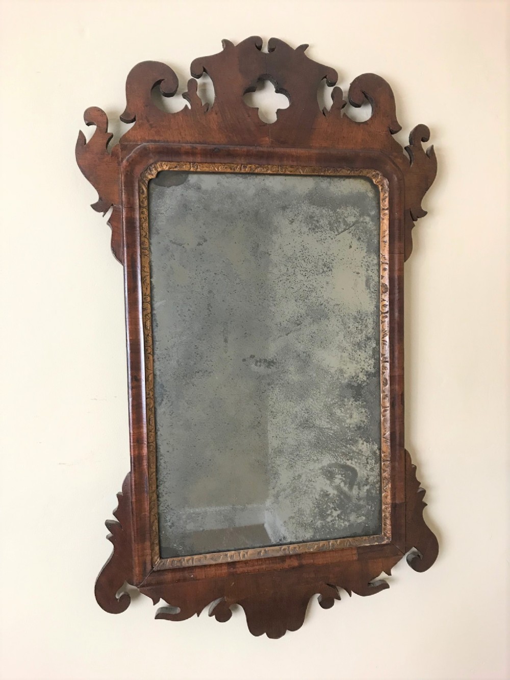 An early George 111 mahogany and parcel gilt wall mirror circa 1760