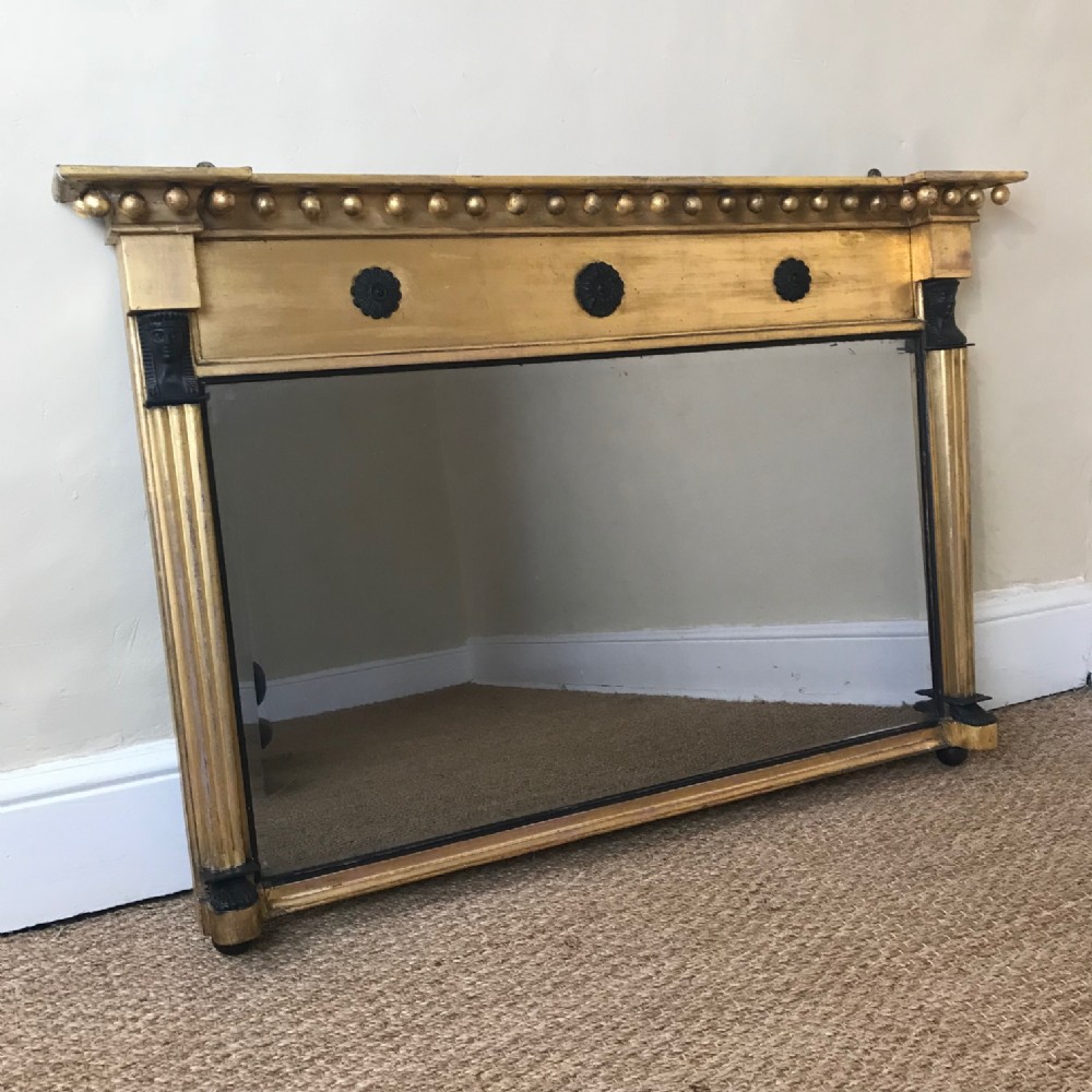 A Regency gilt over mantle mirror circa 1820 in the Egyptian taste